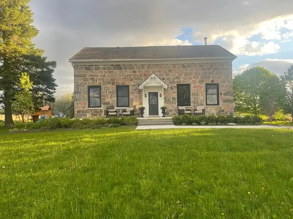 Bittner Manor, the 1840s stone farmhouse on the front lawn