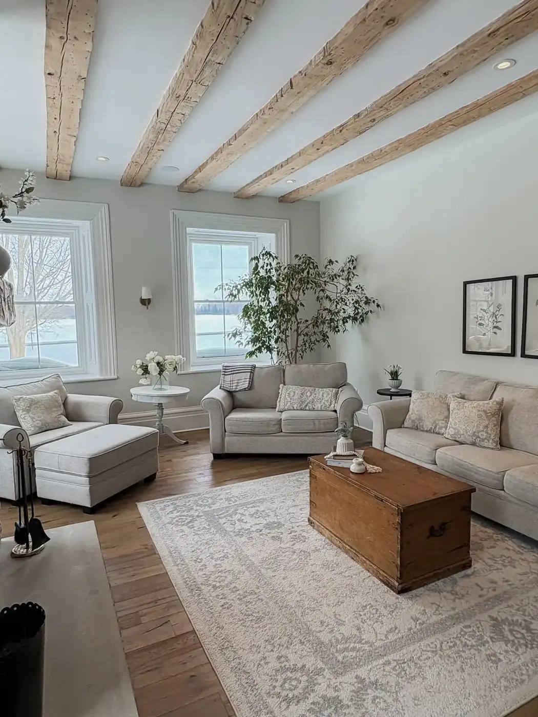 Living room with original beams and stone fireplace